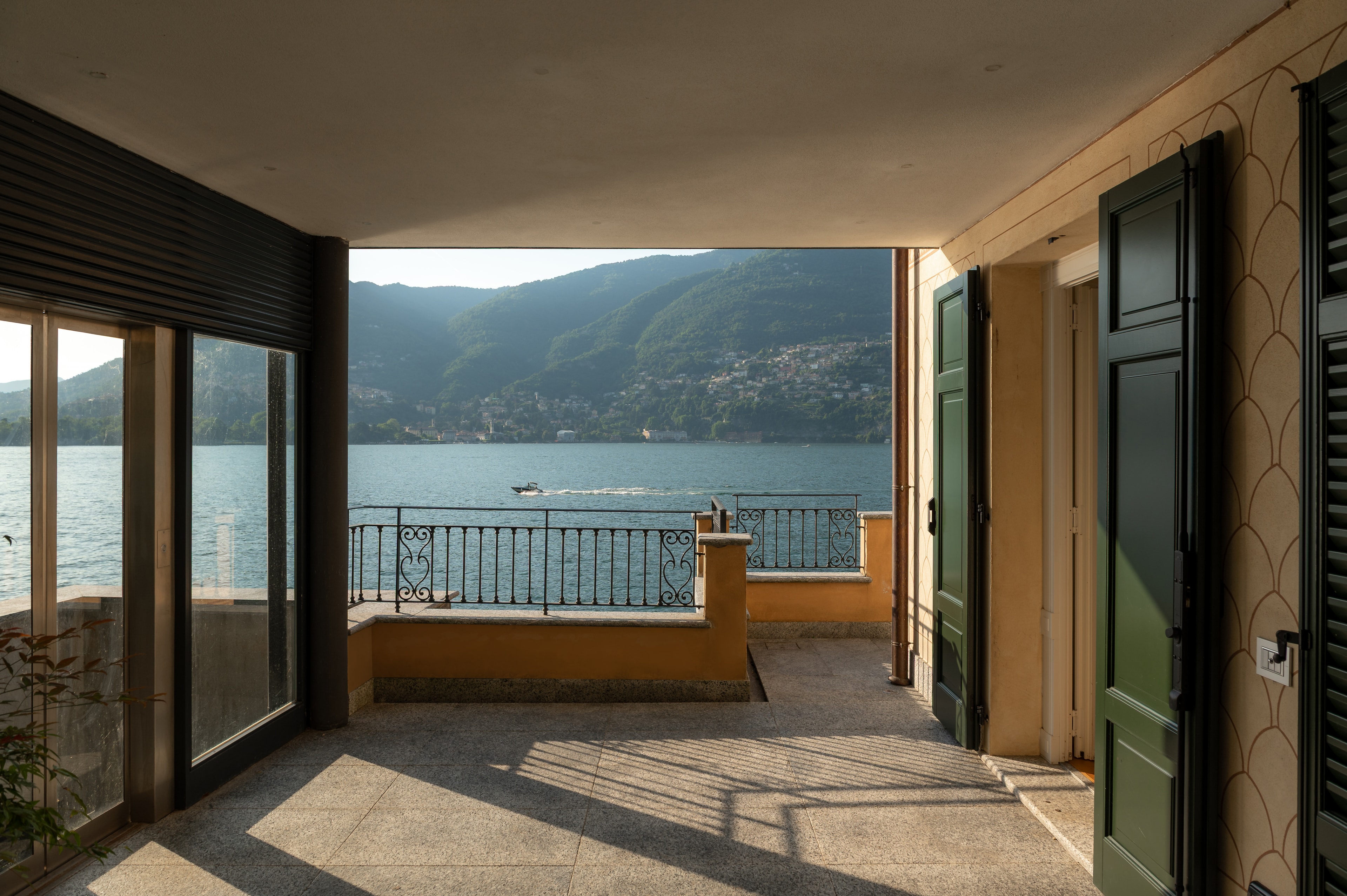 Villa Del Sole terrace with lake view, iron balustrade and green shutters